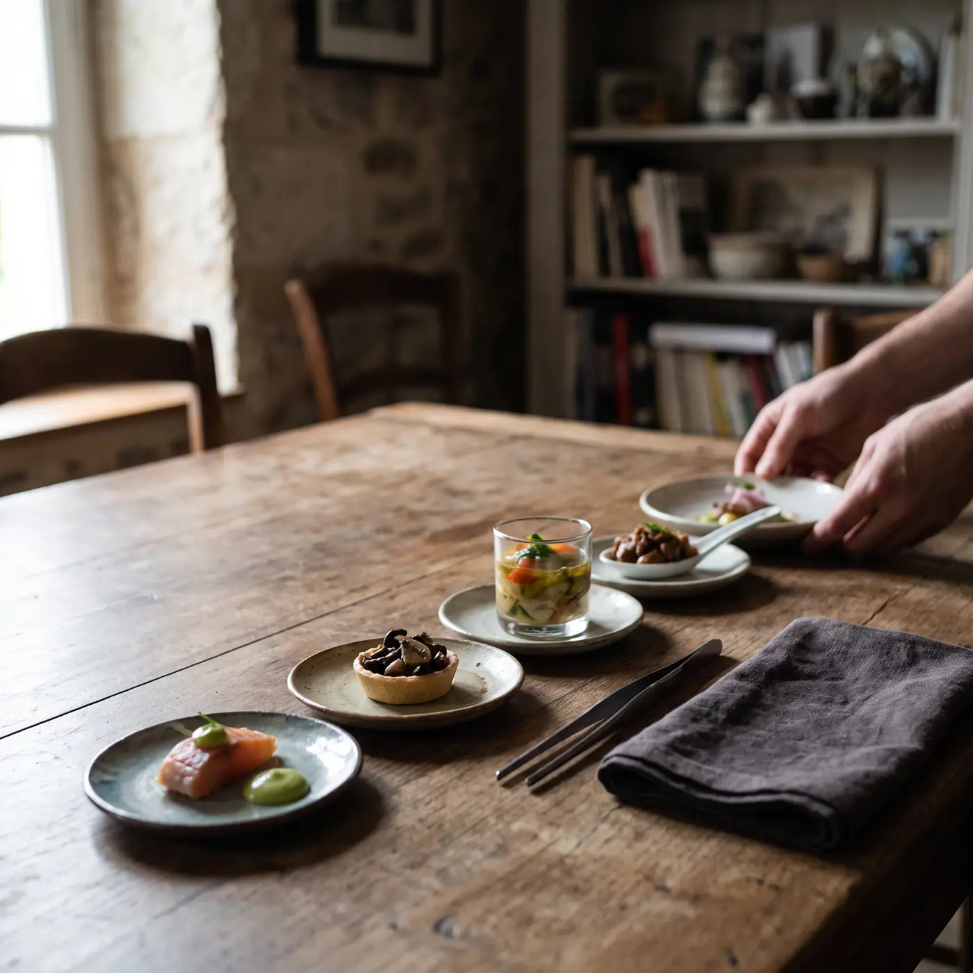 Tasting menu plates dark table fine dining tweezers napkin