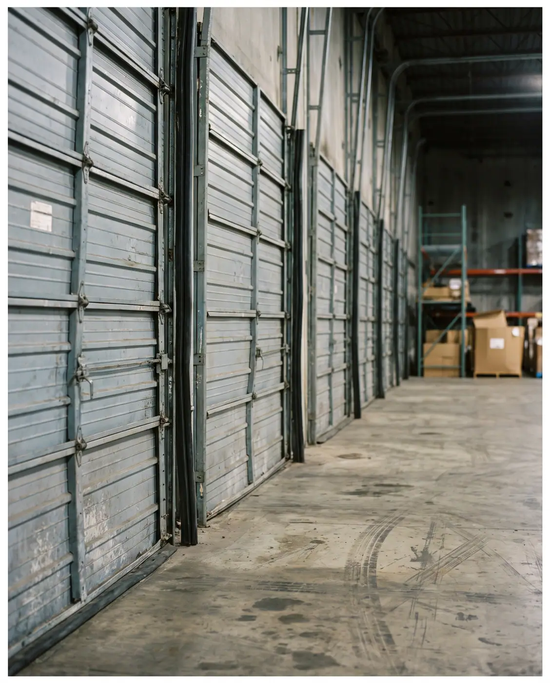 Closed dock doors warehouse distribution center indoor straight on