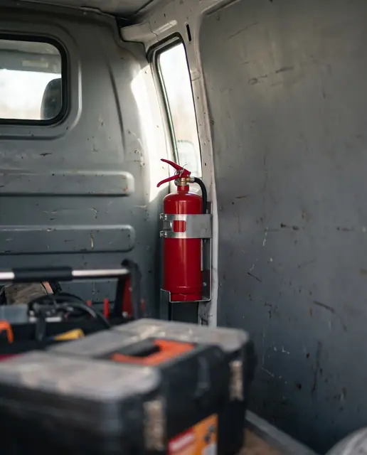 Portable fire extinguisher mounted in works vehicle safety